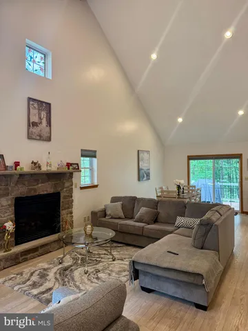 a living room with furniture and stairs