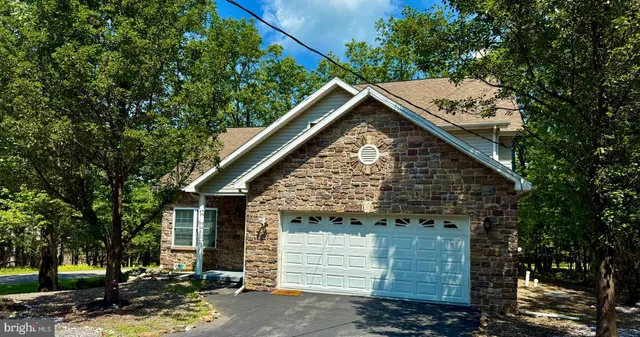 a view of a house with a tree