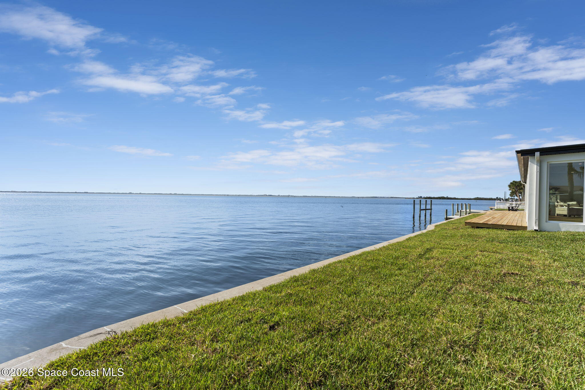 1775 East Riviera Drive Merritt Island, FL 32952 - Photo 12 of 135 a view of a lake with a yard