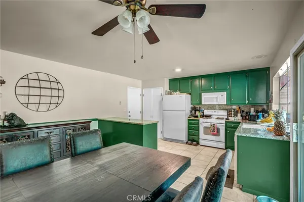 a kitchen with cabinets and a wooden floor