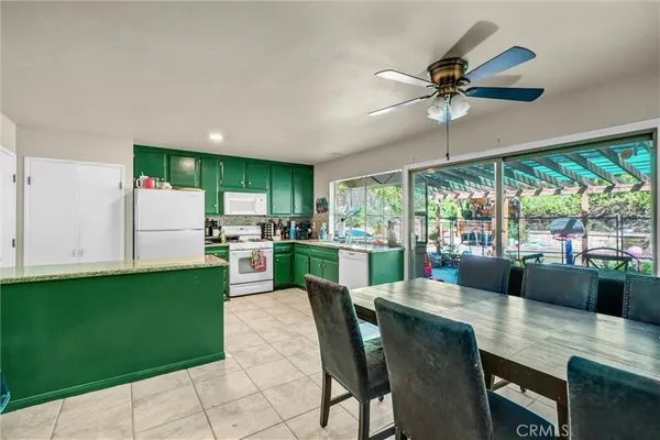 a view of a dining room with furniture window and outside view