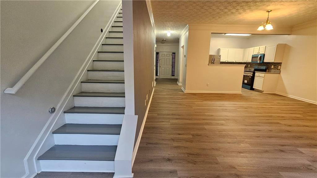 1501 Parc Main Street Lawrenceville, GA 30046 - Photo 3 of 16 a view of an entryway with wooden floor