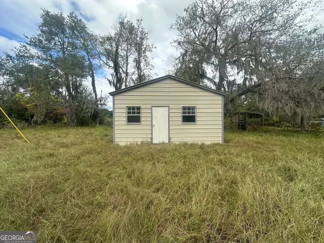 a view of a lake with houses in the back