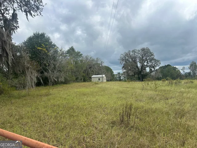 a view of a lake with houses in the back