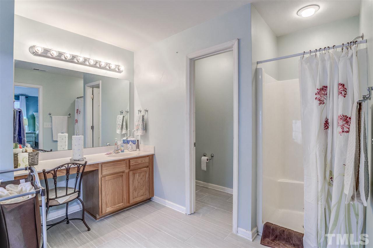 3787 Burtons Barn Street Raleigh, NC 27610 - Photo 22 of 30 Master bathroom with Garden tub and separate shower