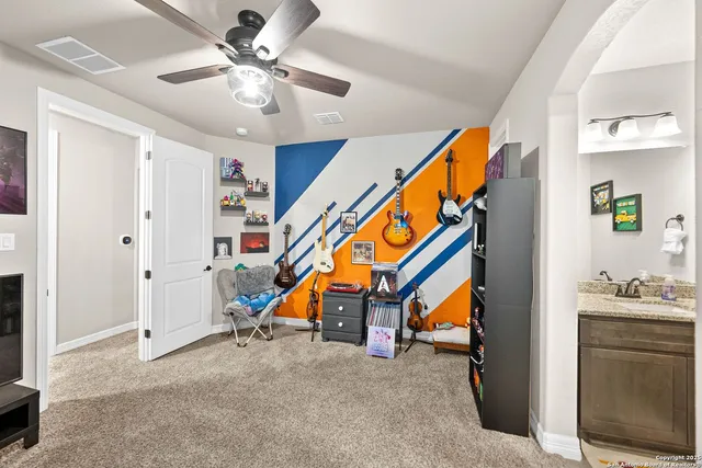 a view of a swimming pool with a table and chairs under an umbrella