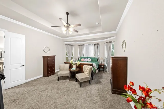 a view of a house with a backyard porch and sitting area