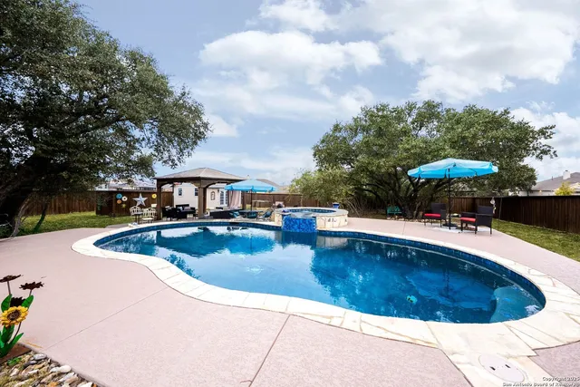 a view of a swimming pool with a patio