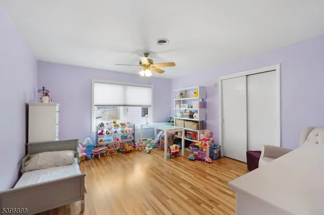 a view of a workspace with furniture and a wooden floor