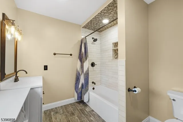 a bathroom with a sink and shower