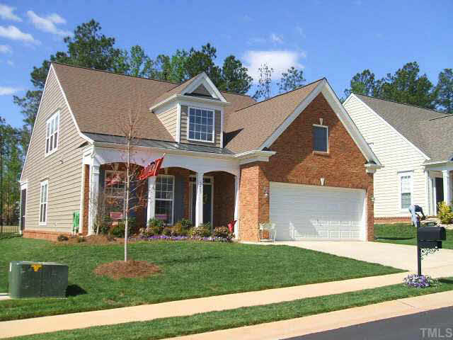 3405 Cathedral Bell Road Raleigh, NC 27614 - Photo 1 of 10 a view of a yard in front of a house with plants and large tree
