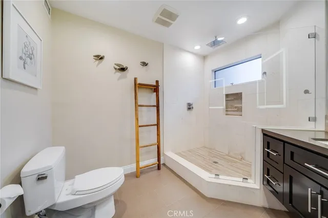 a bedroom with bed and walk in closet