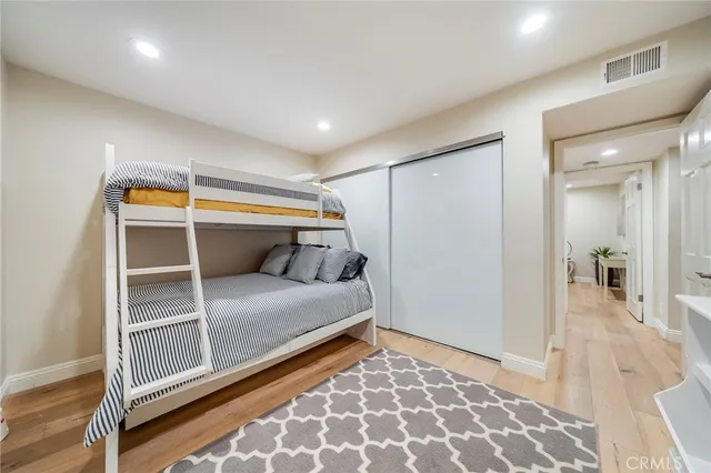 a bedroom with a bed and a couch