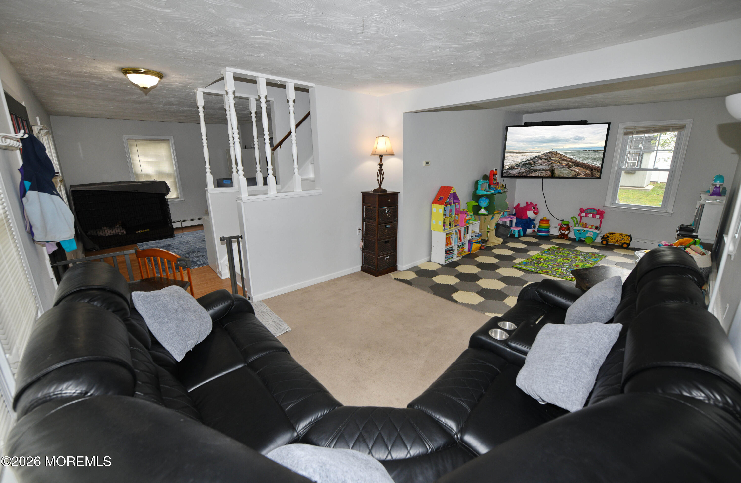 232 Pearce Avenue Point Pleasant, NJ 08742 - Photo 6 of 27 a living room with furniture and a flat screen tv