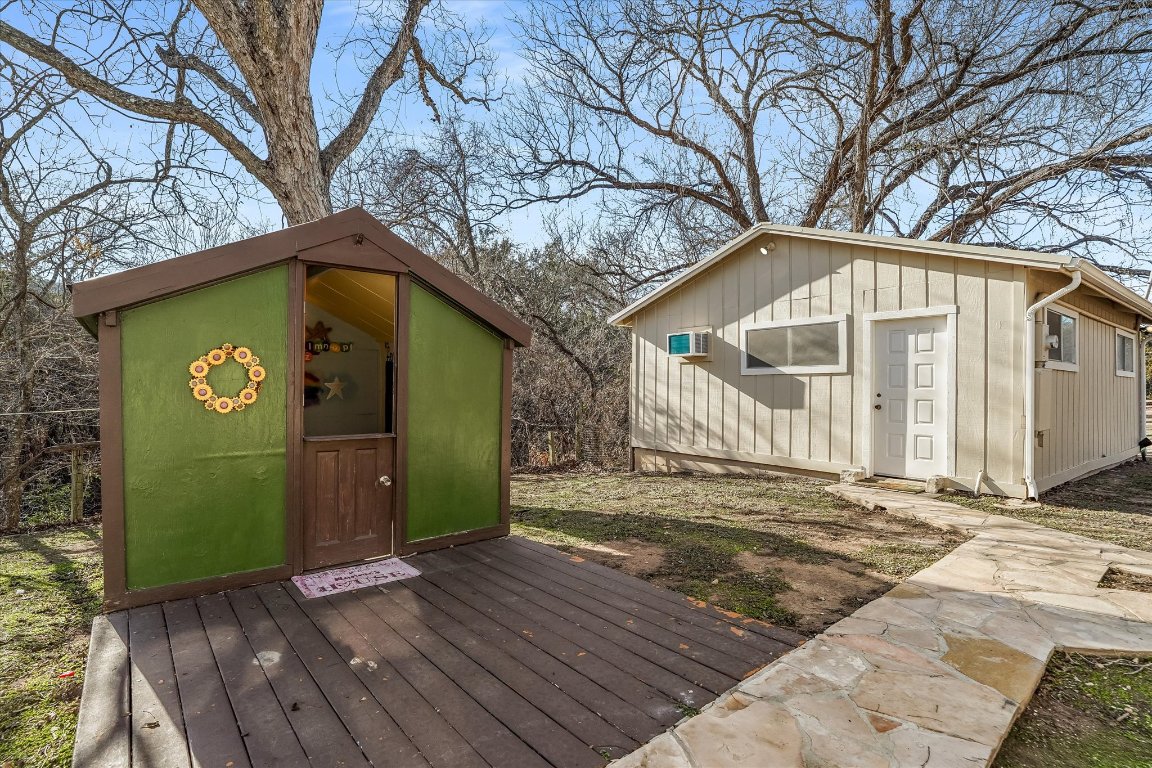 1300 Flite Acres Road Wimberley, TX 78676 - Photo 36 of 40 Kids play house and garage/workshop