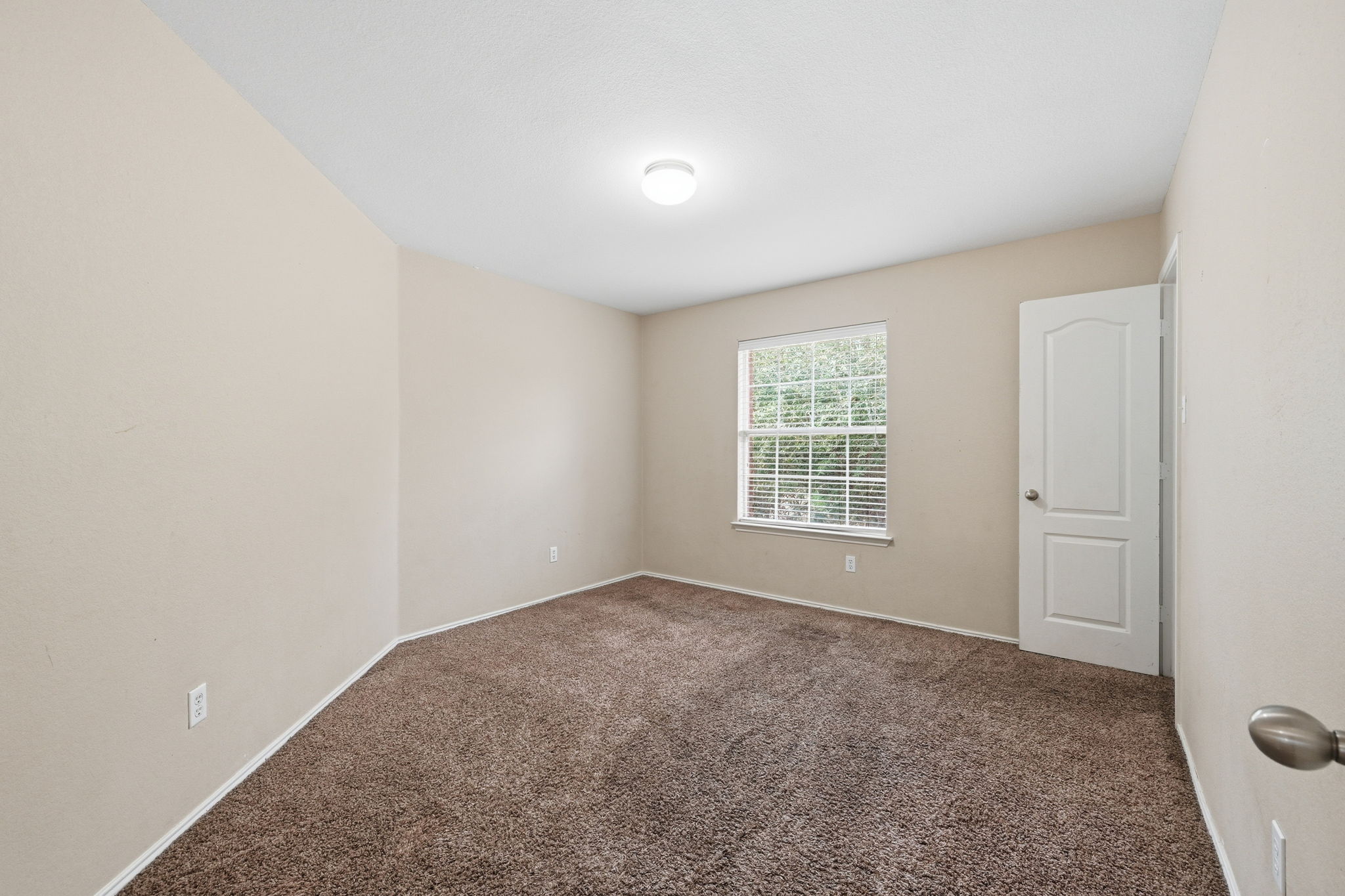 12621 Waynespur Lane Elgin, TX 78621 - Photo 15 of 34 a view of an empty room with a window