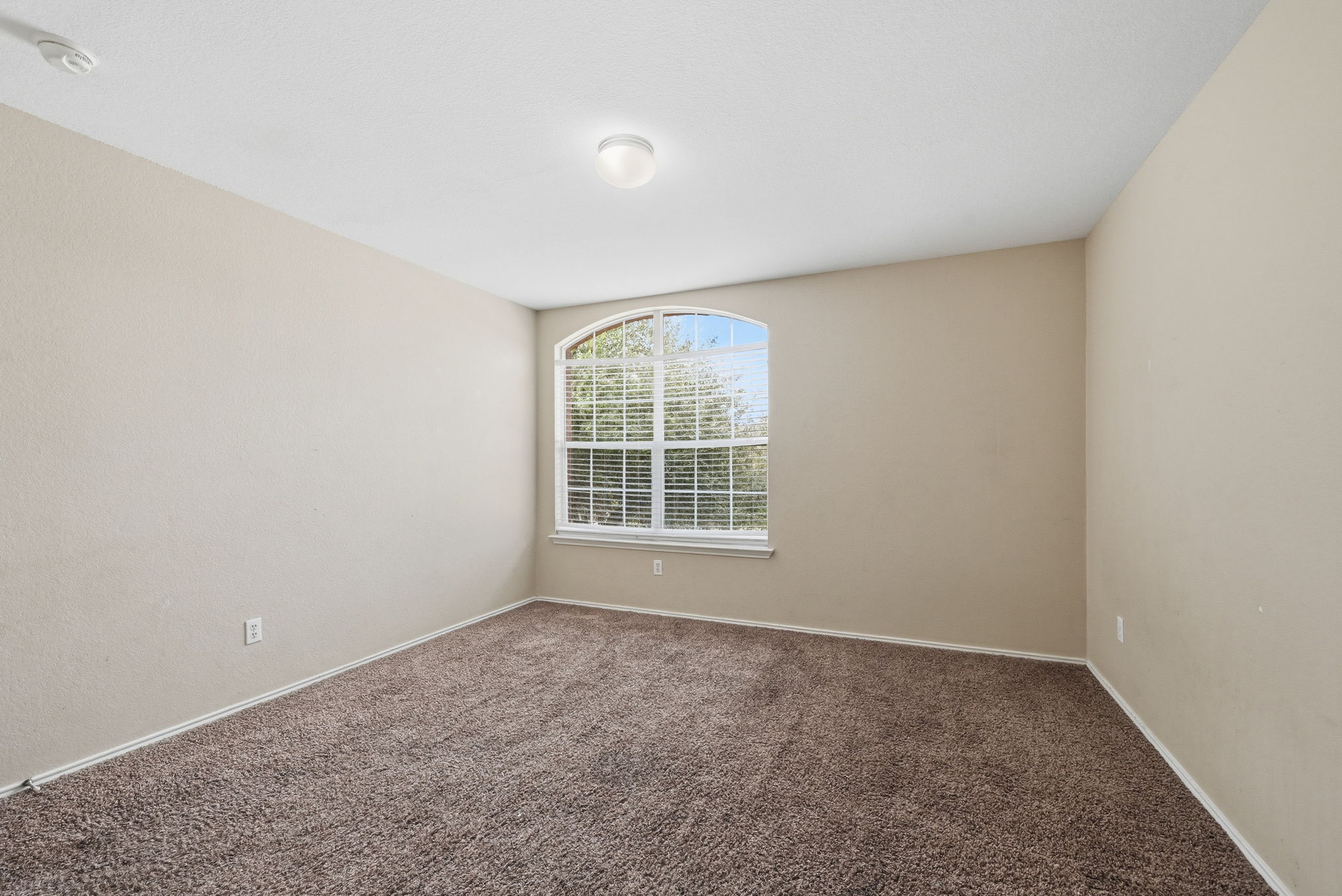 12621 Waynespur Lane Elgin, TX 78621 - Photo 19 of 34 an empty room with a window