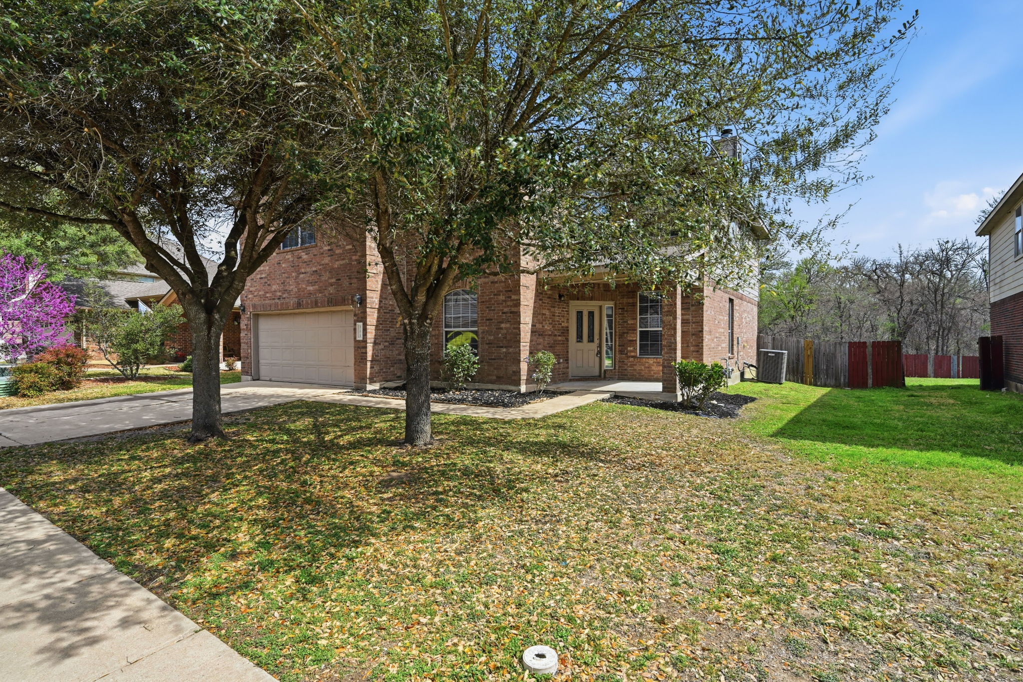 12621 Waynespur Lane Elgin, TX 78621 - Photo 2 of 34 a house with trees in the background