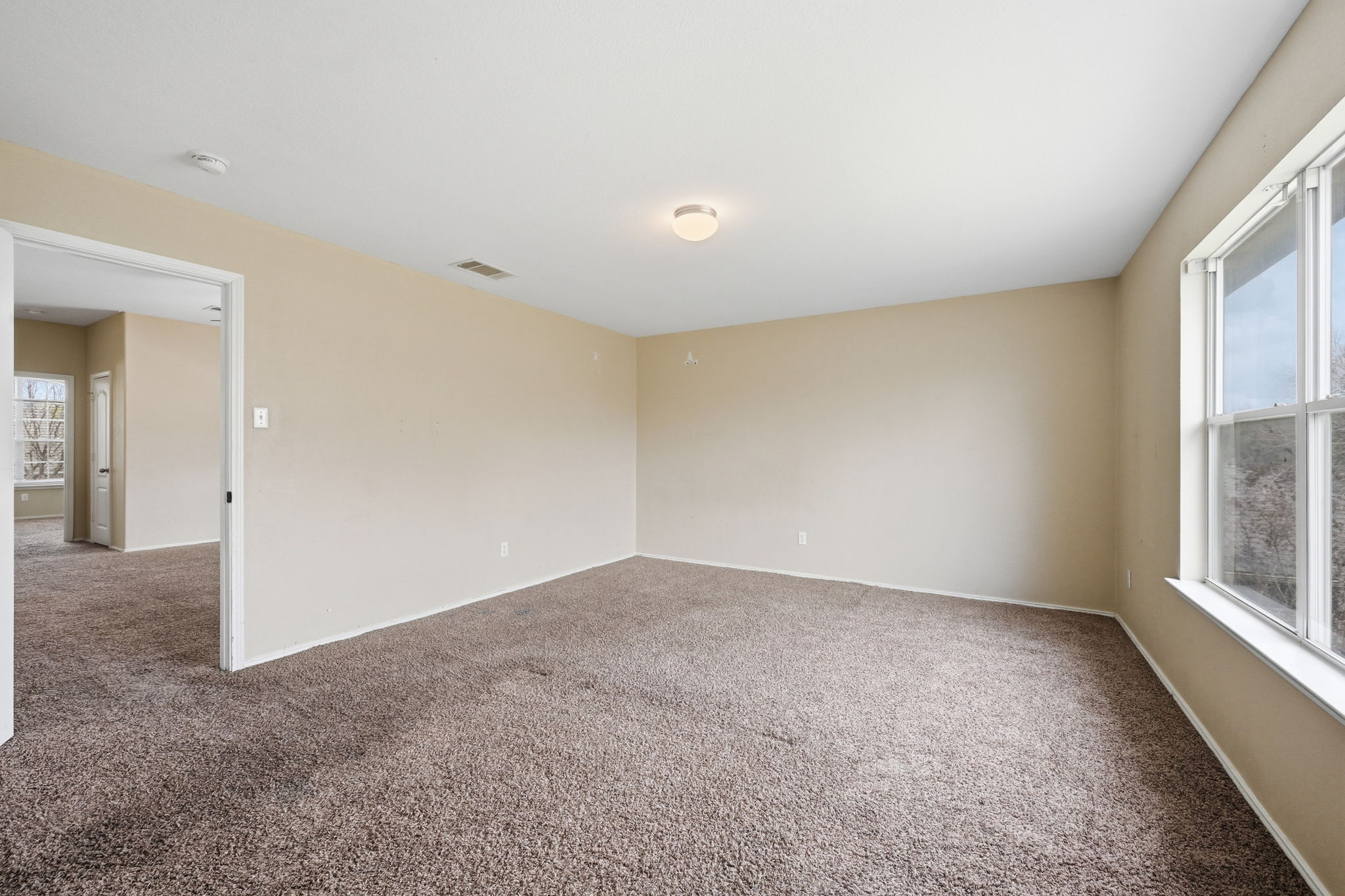 12621 Waynespur Lane Elgin, TX 78621 - Photo 21 of 34 an empty room with windows