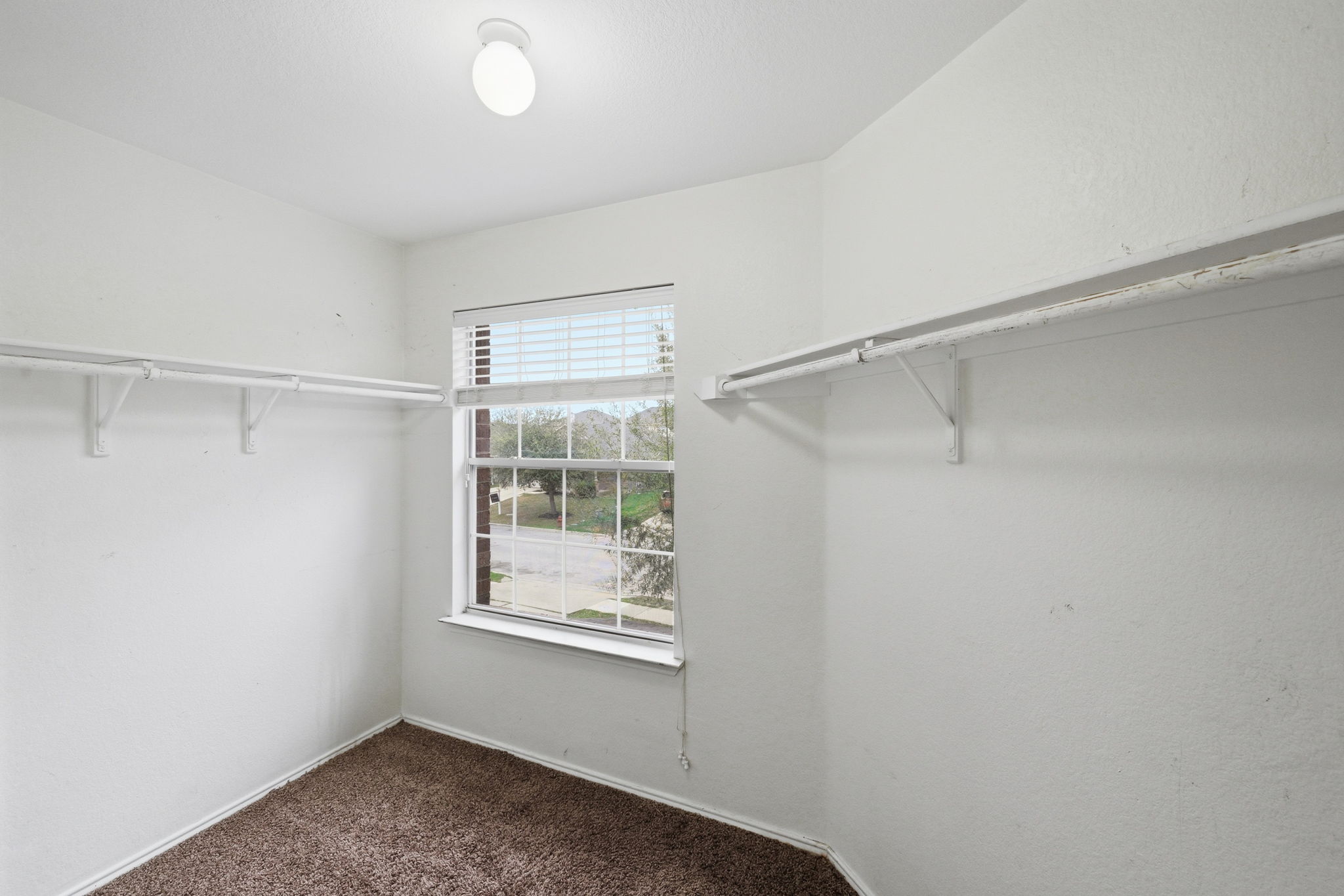 12621 Waynespur Lane Elgin, TX 78621 - Photo 22 of 34 a view of an empty room with a window