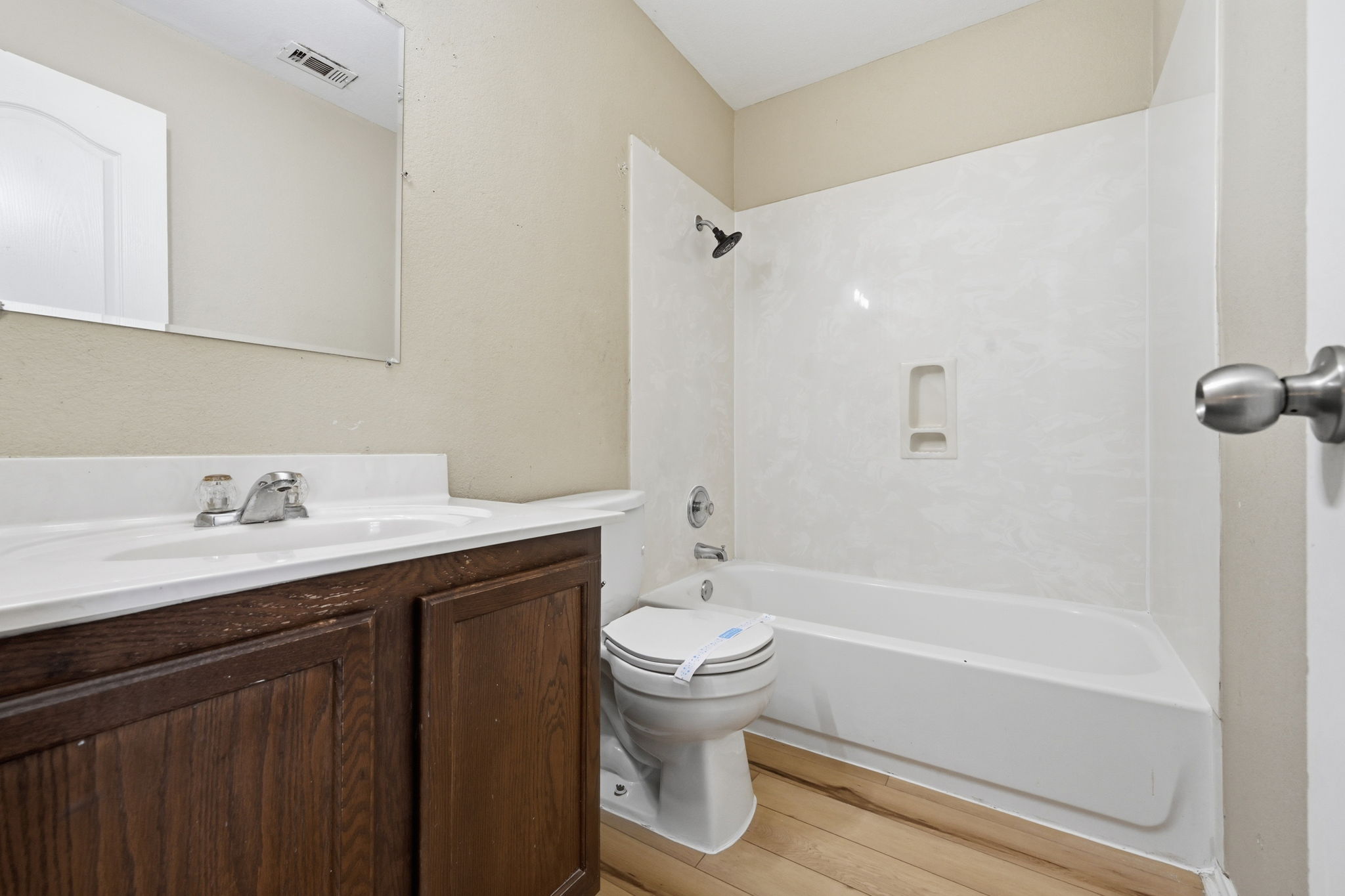 12621 Waynespur Lane Elgin, TX 78621 - Photo 25 of 34 a bathroom with a sink a toilet and shower