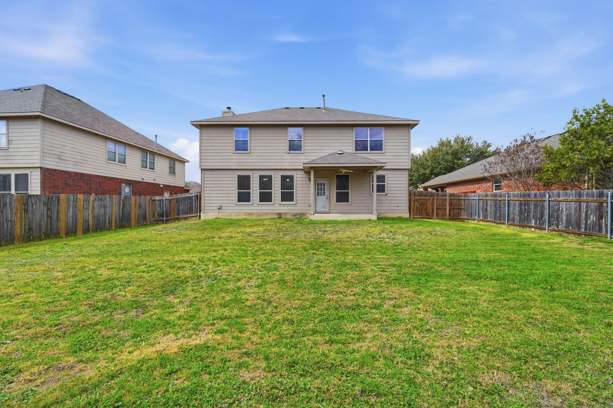 12621 Waynespur Lane Elgin, TX 78621 - Photo 28 of 34 a front view of a house with garden