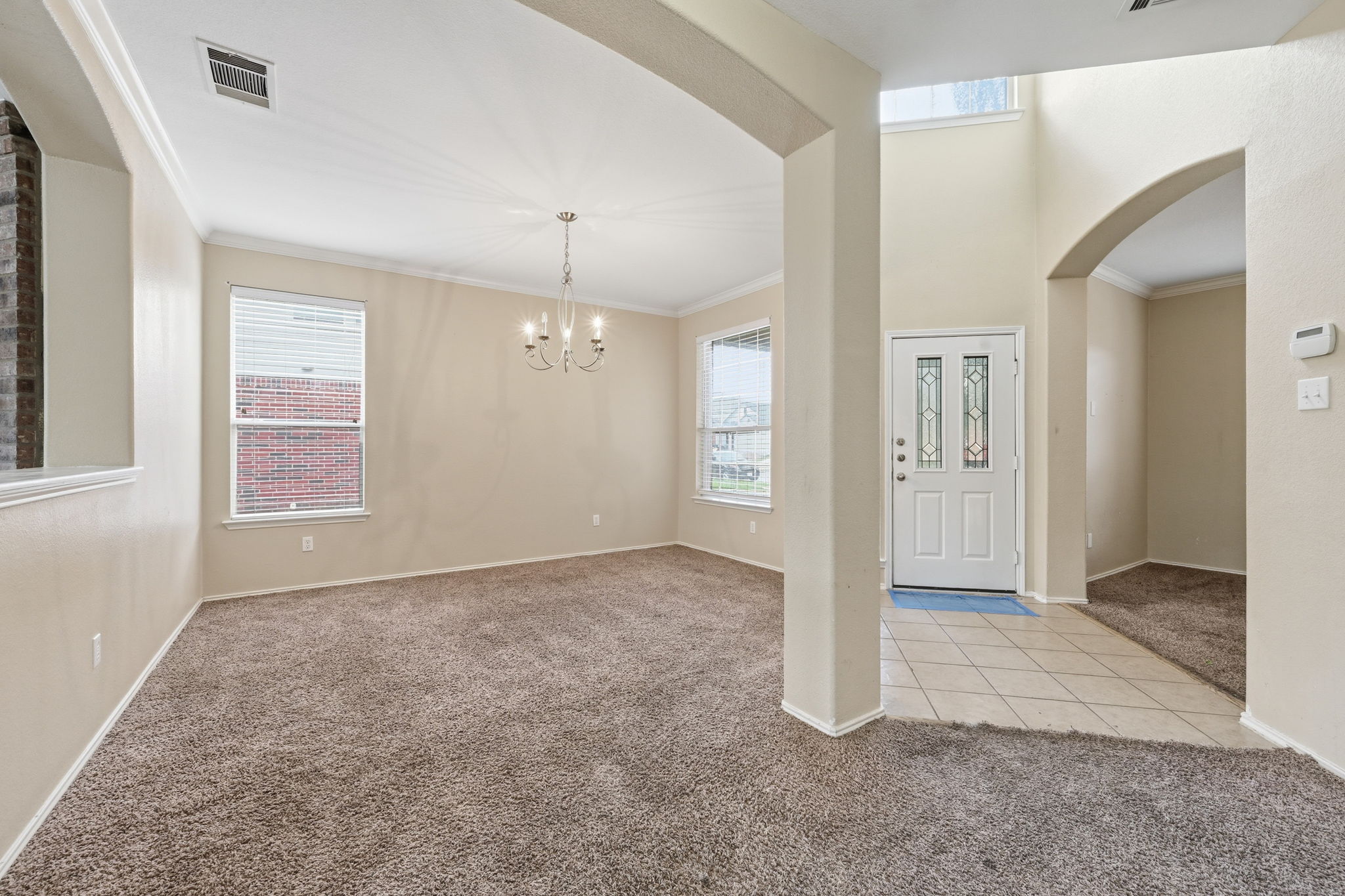 12621 Waynespur Lane Elgin, TX 78621 - Photo 4 of 34 an empty room with windows and closet