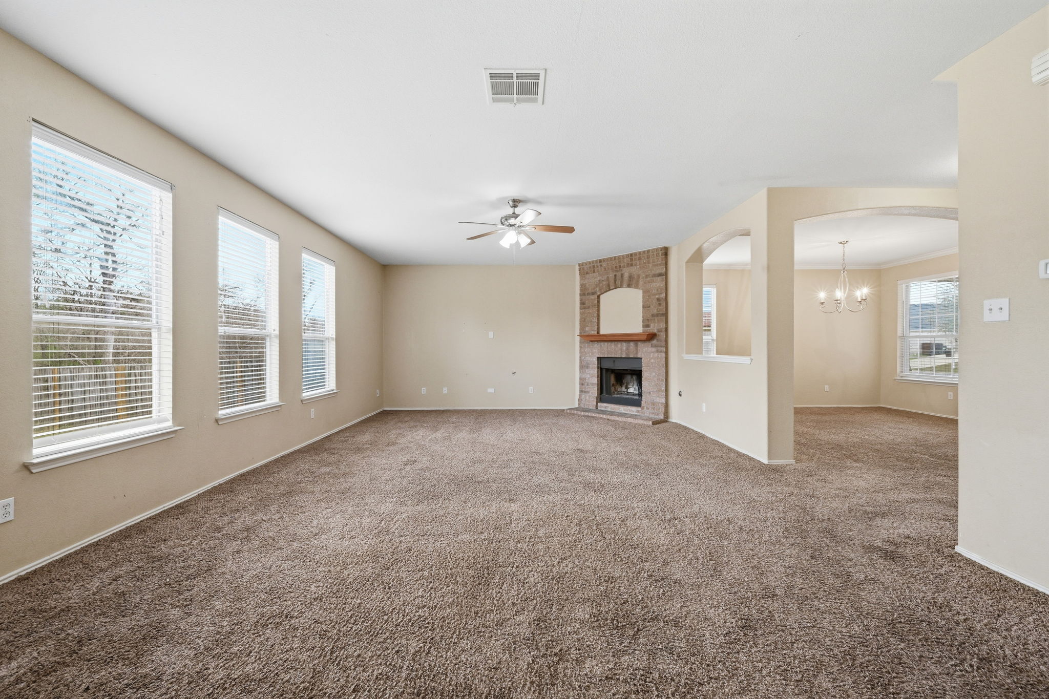 12621 Waynespur Lane Elgin, TX 78621 - Photo 6 of 34 a view of an empty room with a window