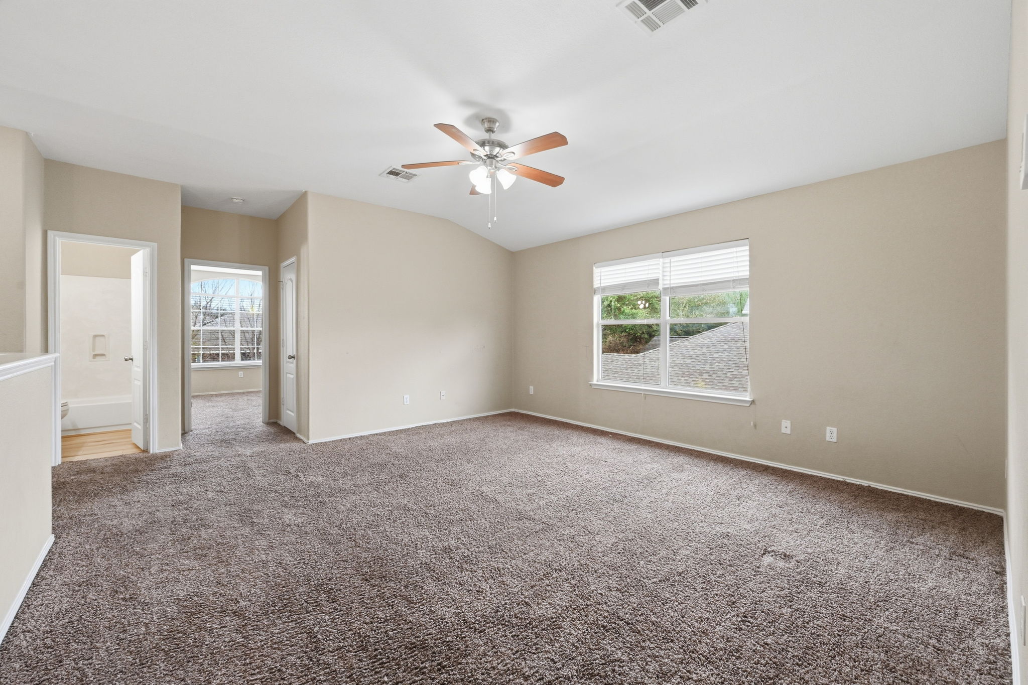 12621 Waynespur Lane Elgin, TX 78621 - Photo 8 of 34 a view of an empty room with a window