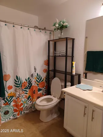 a bathroom with a shower and a sink