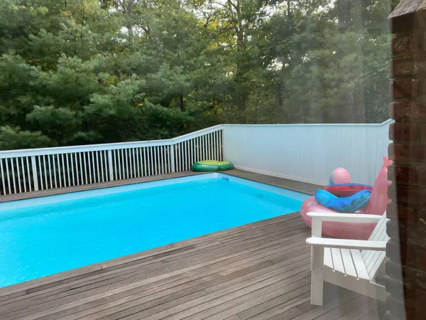 a view of a chairs and table in patio