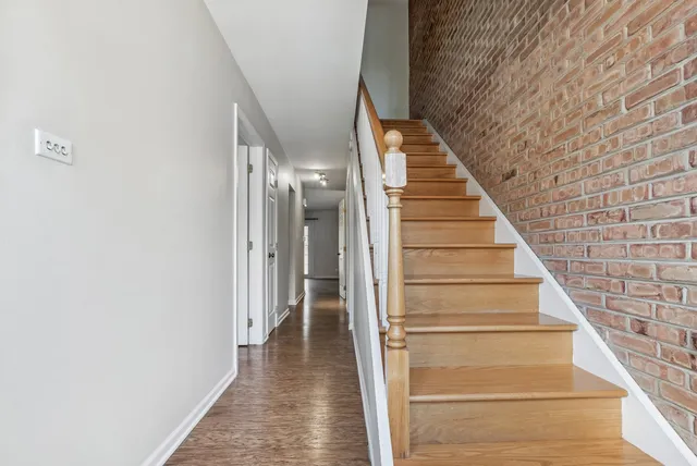 a view of staircase with white walls