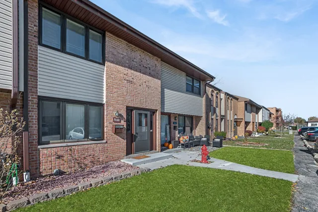 a view of a building with a yard