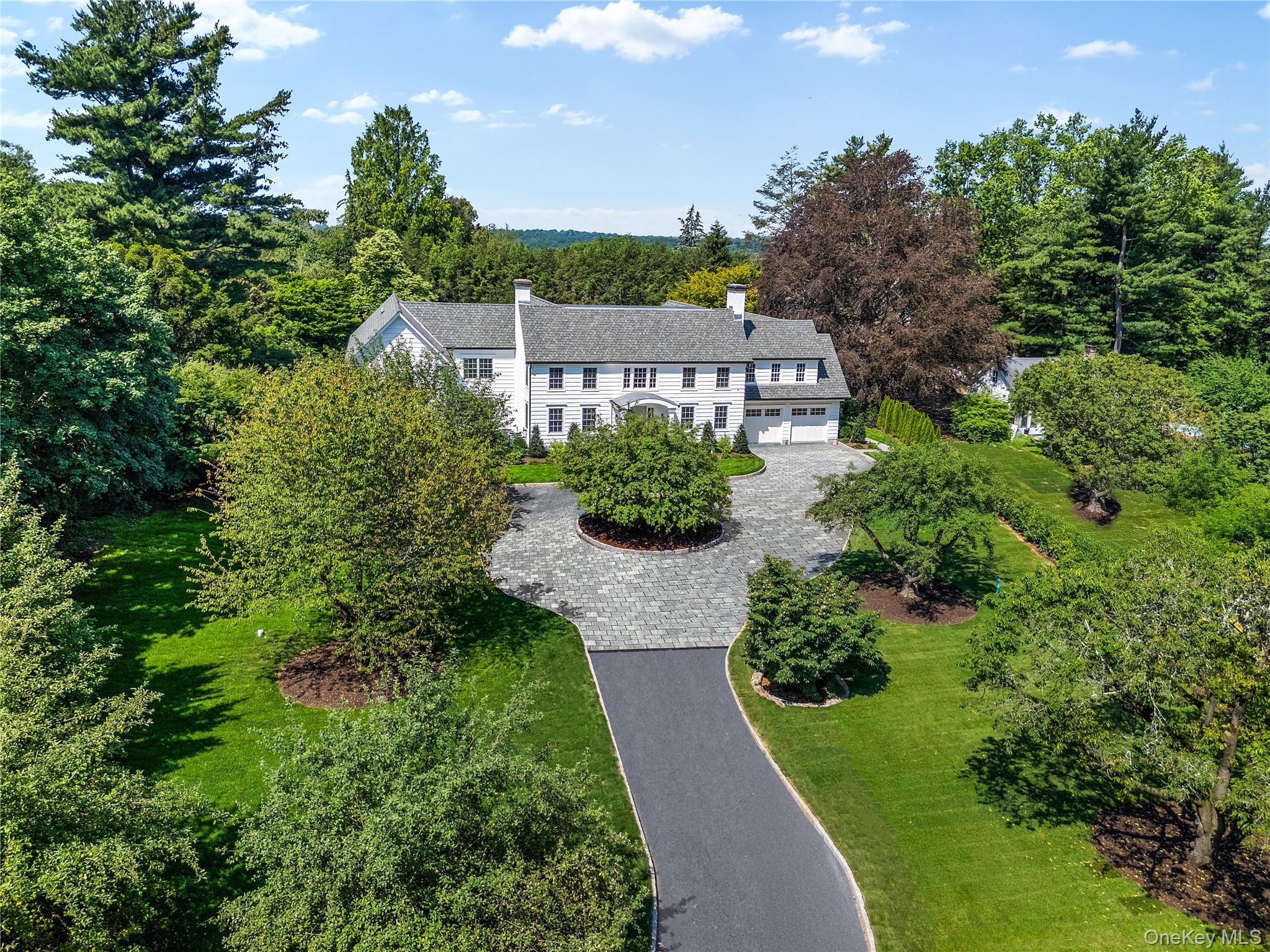 42 Mamaroneck Road Scarsdale, NY 10583 - Photo 1 of 47 Set way back beyond a grand gated entrance this impressive home creates an unforgettable first impression, surrounded by beautifully landscaped 1.5-acre grounds with specimen trees in the heart of the sought-after Murray Hill estate neighborhood in Scarsdale.