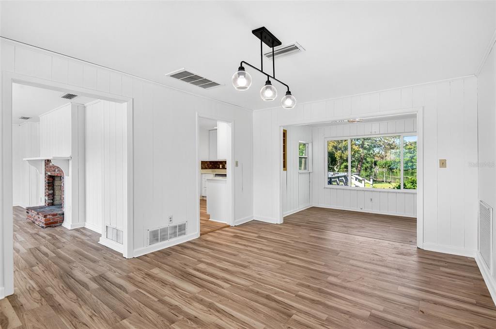 1520 South Keene Road Clearwater, FL 33756 - Photo 12 of 60 a view of empty room with wooden floor and fan