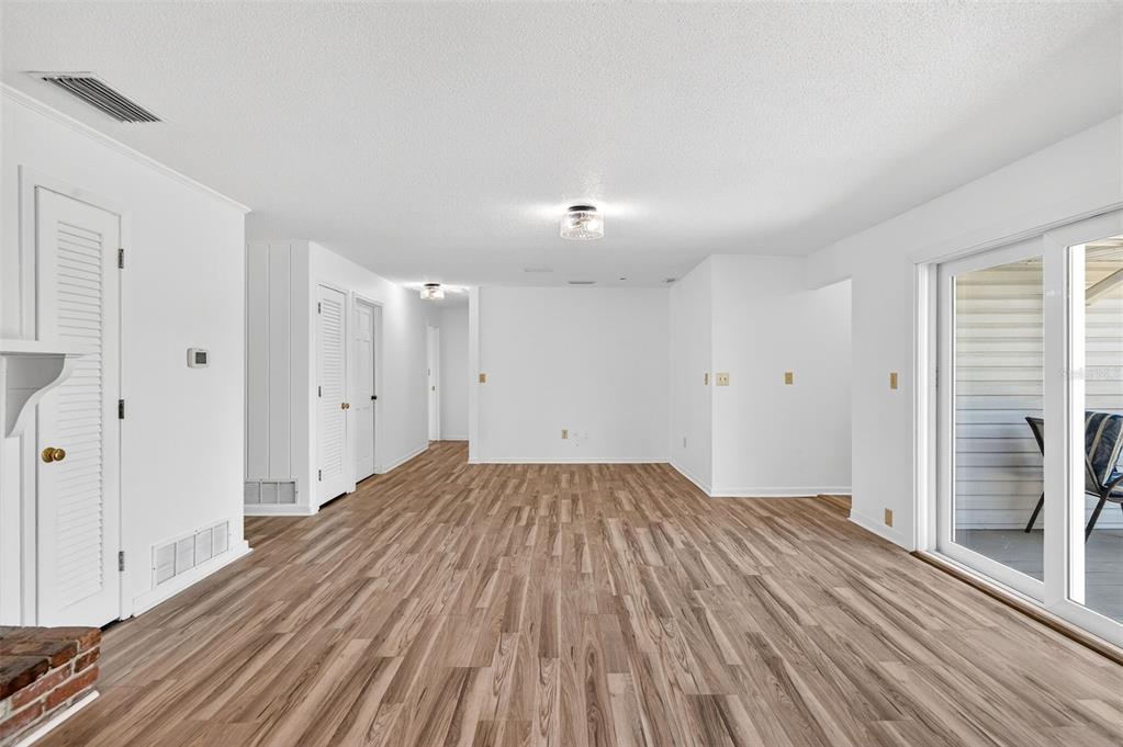 1520 South Keene Road Clearwater, FL 33756 - Photo 24 of 60 a view of empty room with wooden floor and fan