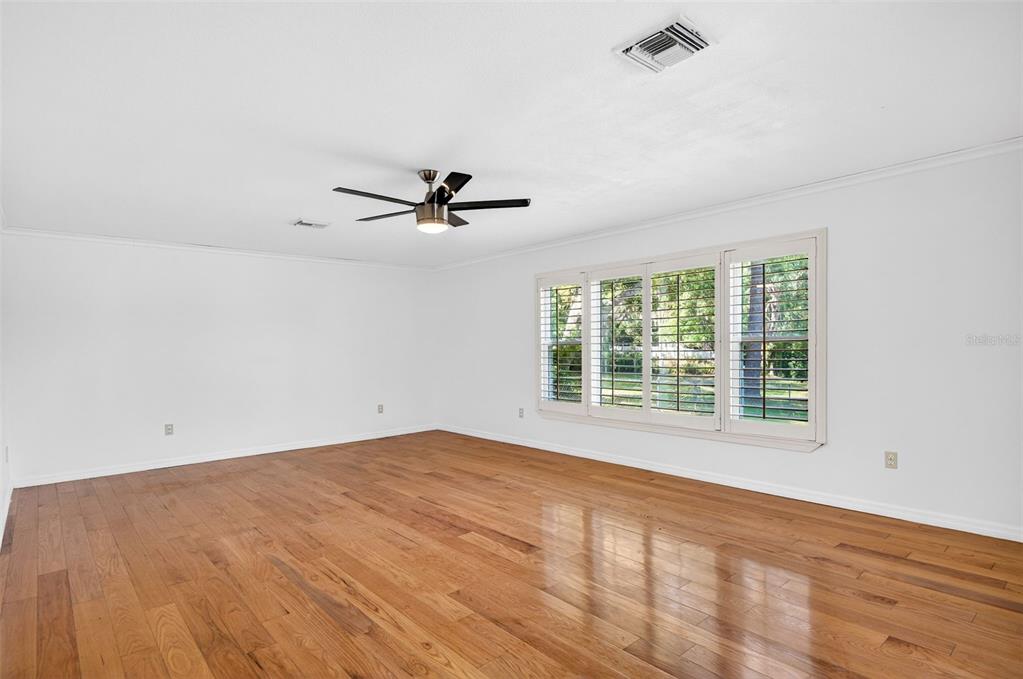 1520 South Keene Road Clearwater, FL 33756 - Photo 28 of 60 a view of a livingroom with a ceiling fan and window