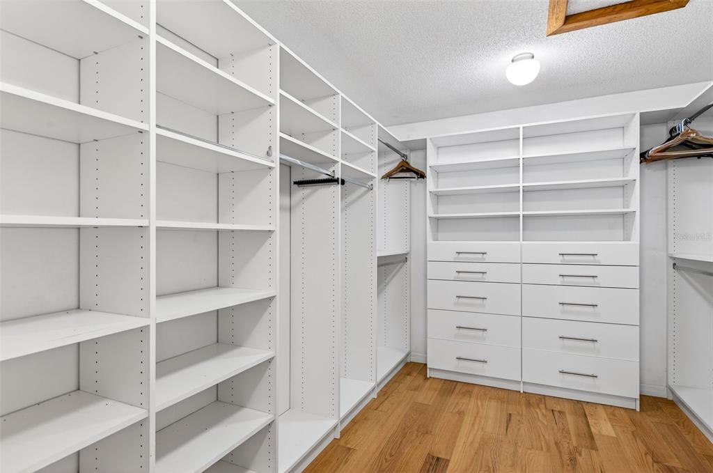 1520 South Keene Road Clearwater, FL 33756 - Photo 29 of 60 a view of walk in closet with empty racks