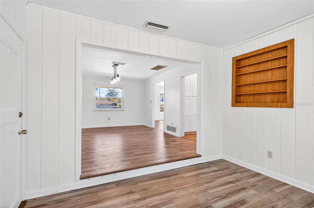 1520 South Keene Road Clearwater, FL 33756 - Photo 36 of 60 a view of an empty room with wooden floor and a window