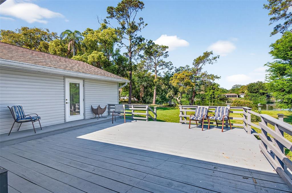 1520 South Keene Road Clearwater, FL 33756 - Photo 41 of 60 swimming pool view with a seating space and garden view