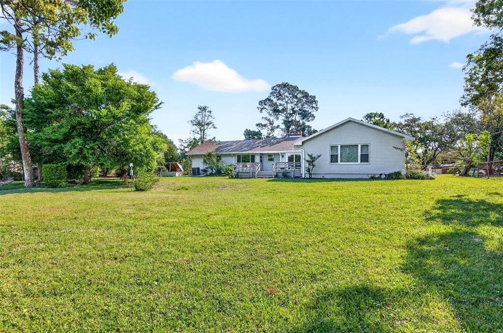 1520 South Keene Road Clearwater, FL 33756 - Photo 46 of 60 a house view with swimming pool in front of it
