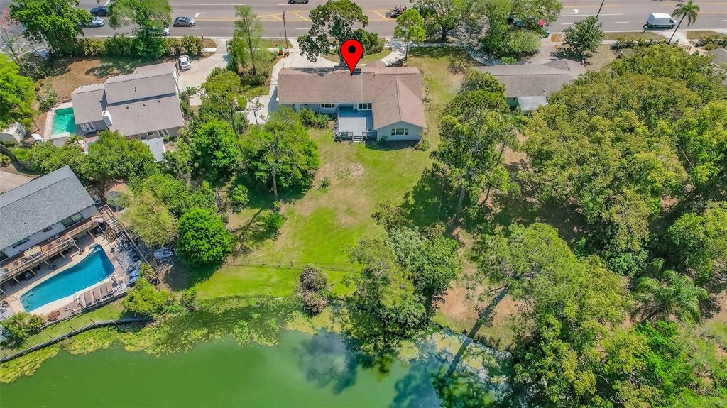 1520 South Keene Road Clearwater, FL 33756 - Photo 56 of 60 an aerial view of a house with pool yard outdoor and lake view