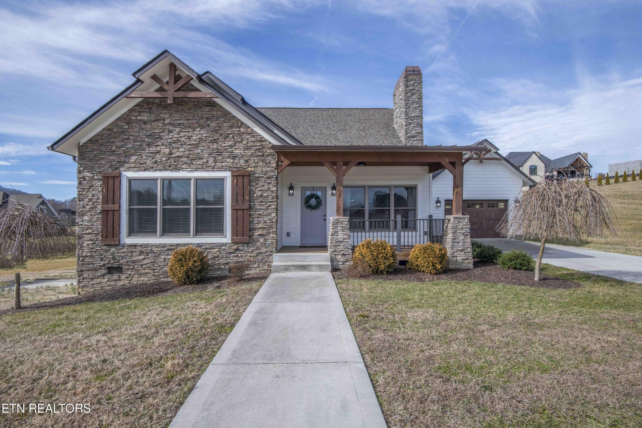 1562 Pullen Road Sevierville, TN 37862 - Photo 1 of 53 a front view of a house with garden