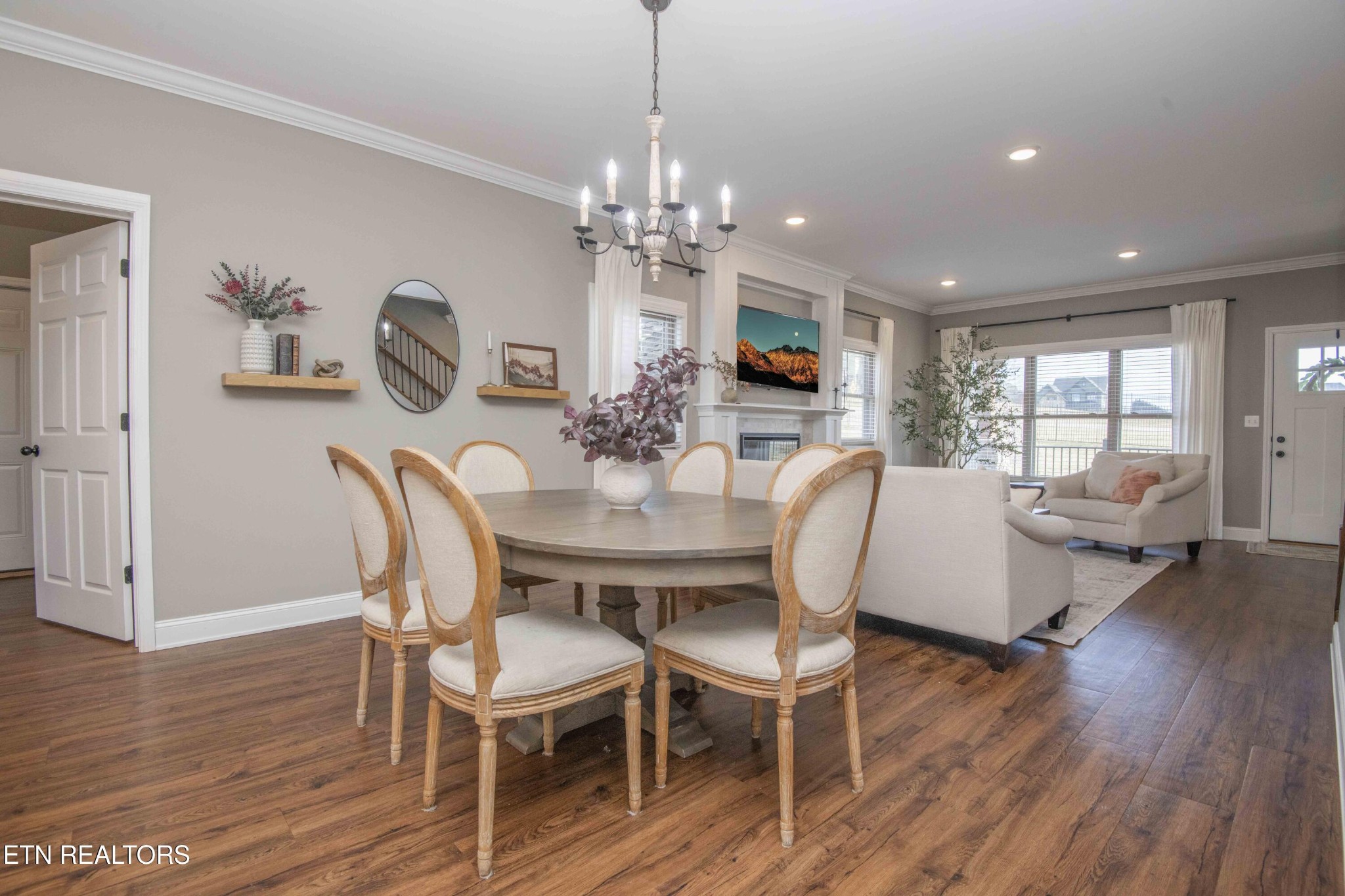 1562 Pullen Road Sevierville, TN 37862 - Photo 15 of 53 a view of a dining room with furniture a chandelier and wooden floor