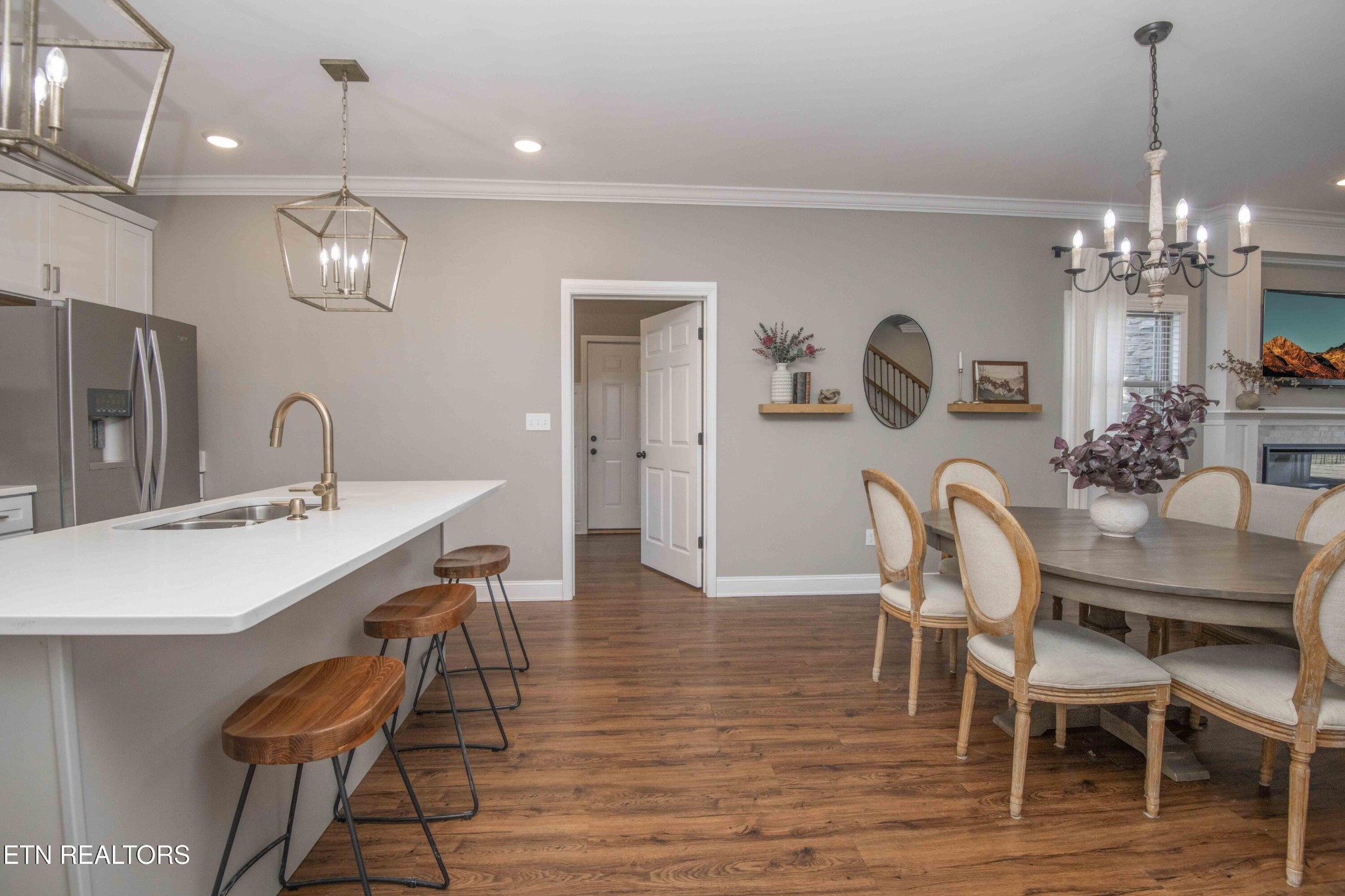 1562 Pullen Road Sevierville, TN 37862 - Photo 19 of 53 a view of a dining room with furniture a chandelier and wooden floor