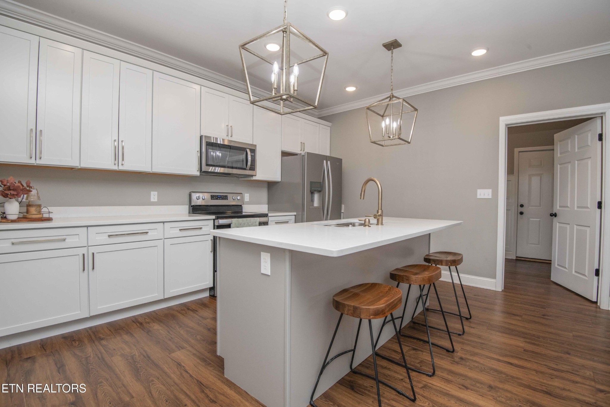 1562 Pullen Road Sevierville, TN 37862 - Photo 22 of 53 a kitchen with a sink cabinets and wooden floor