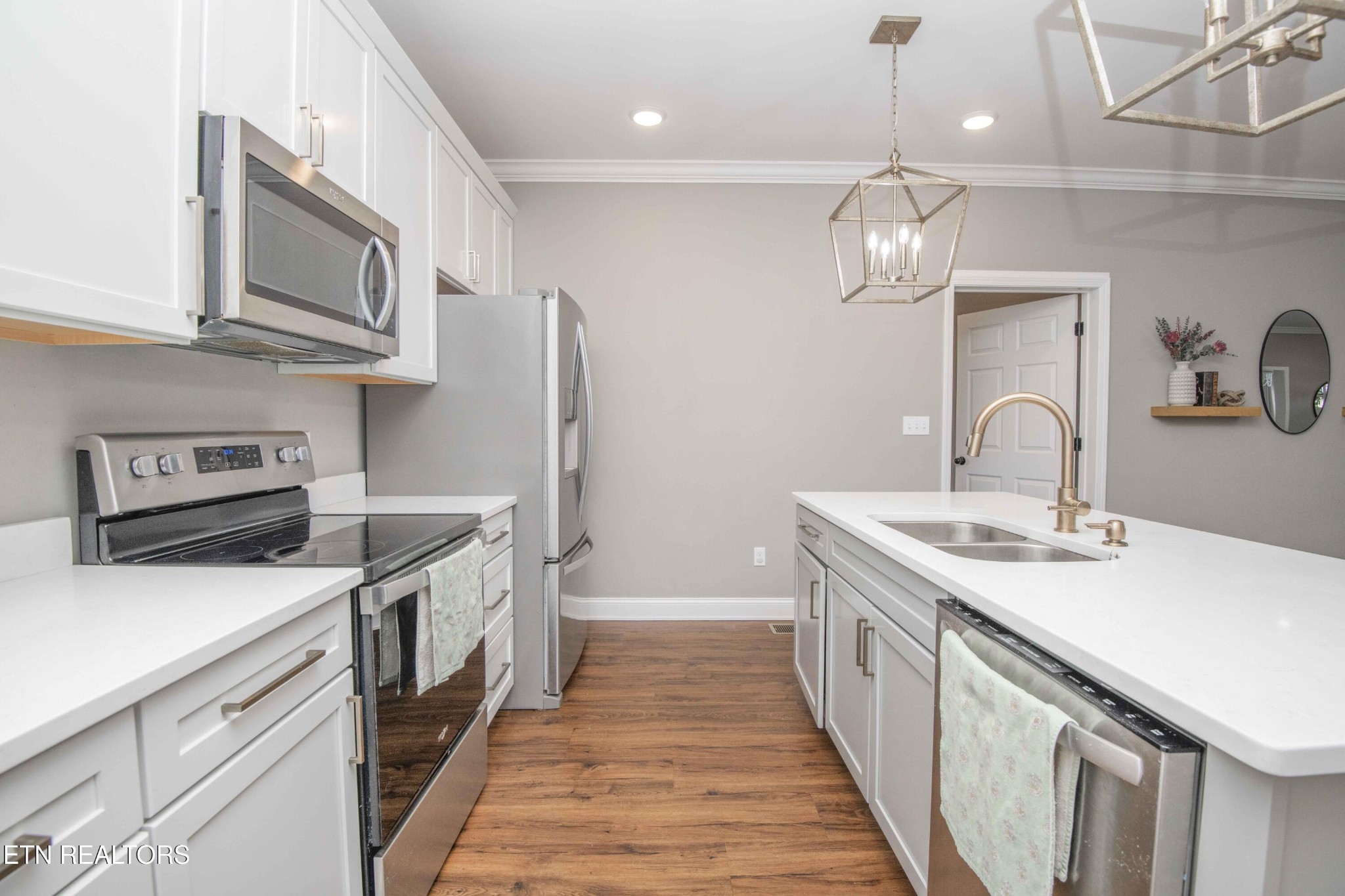 1562 Pullen Road Sevierville, TN 37862 - Photo 24 of 53 a kitchen with stainless steel appliances granite countertop a sink a stove and a refrigerator