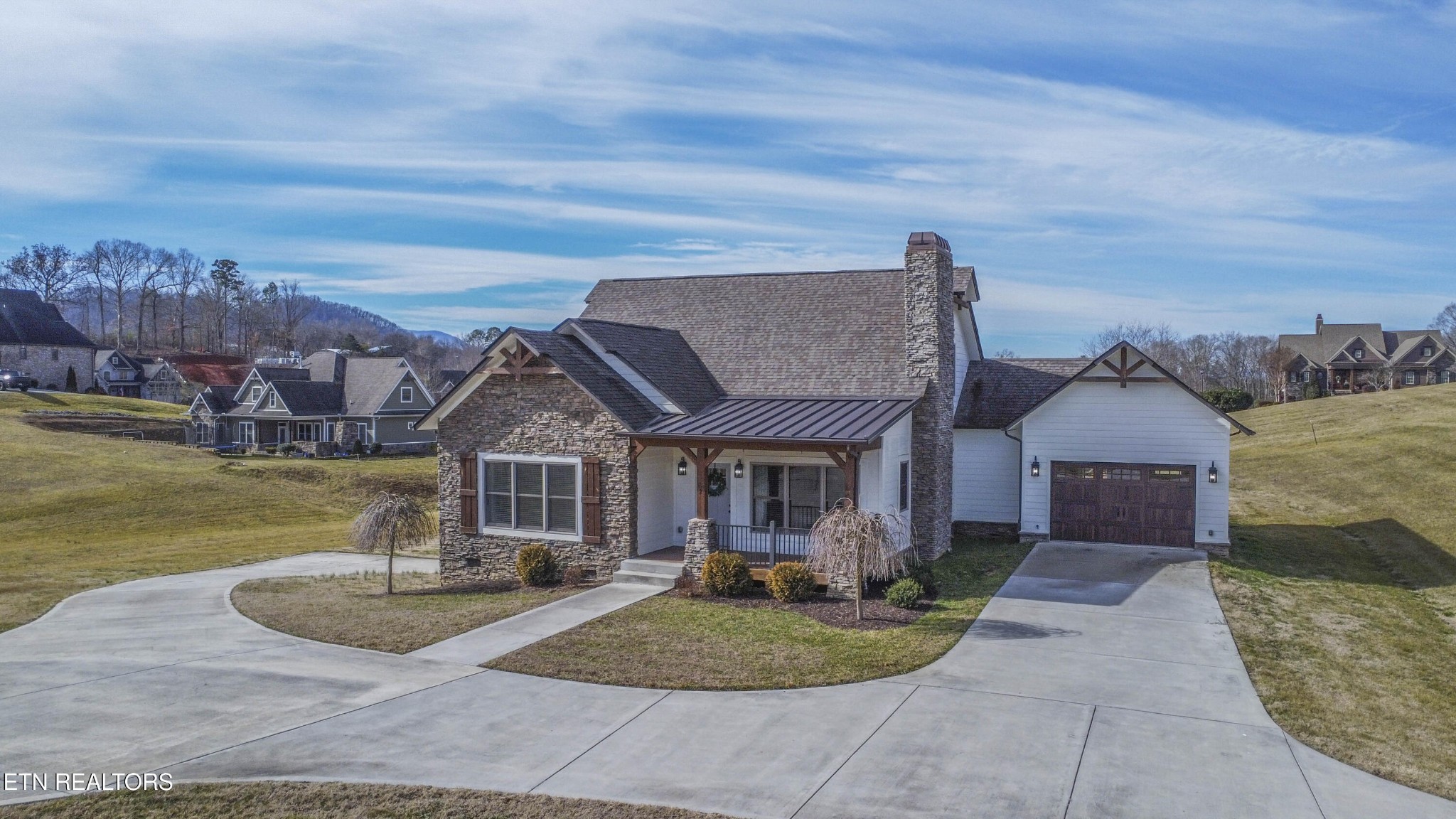 1562 Pullen Road Sevierville, TN 37862 - Photo 4 of 53 a front view of a house with garden