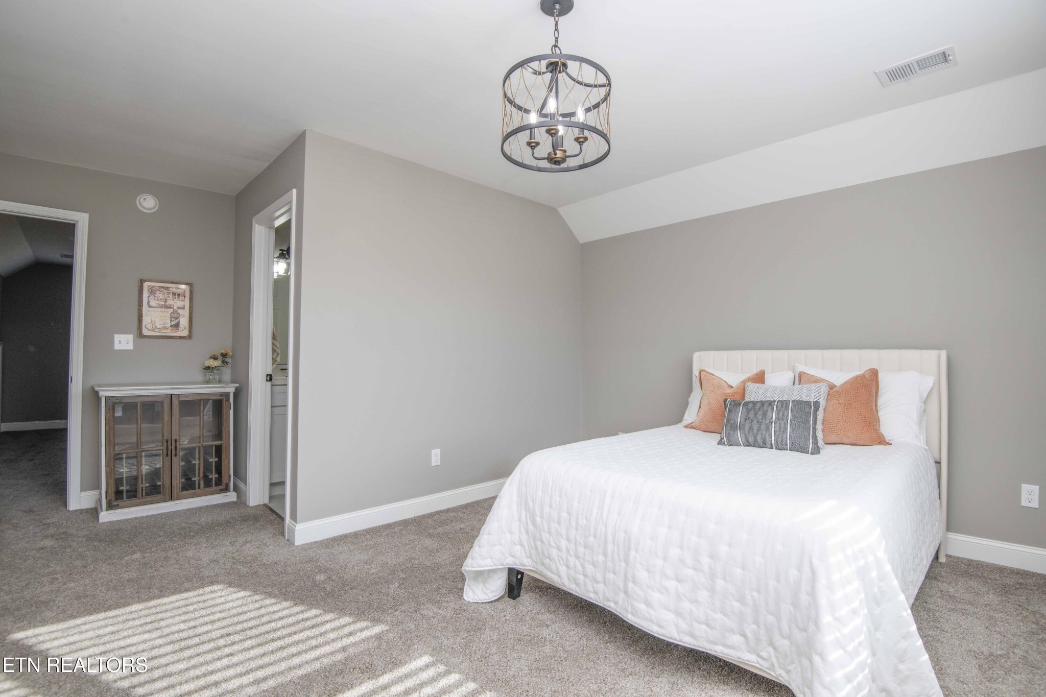 1562 Pullen Road Sevierville, TN 37862 - Photo 44 of 53 a bedroom with a large bed and chandelier