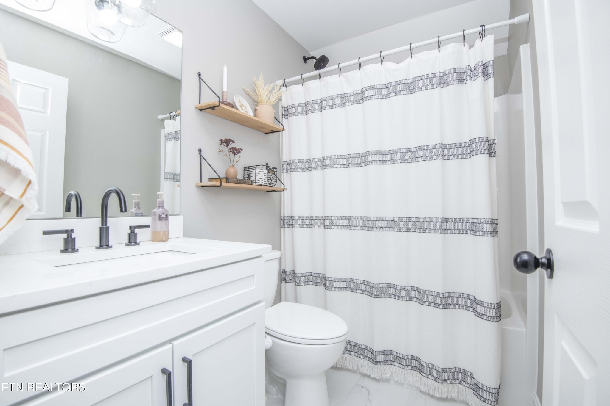 1562 Pullen Road Sevierville, TN 37862 - Photo 45 of 53 a bathroom with a sink toilet and shower
